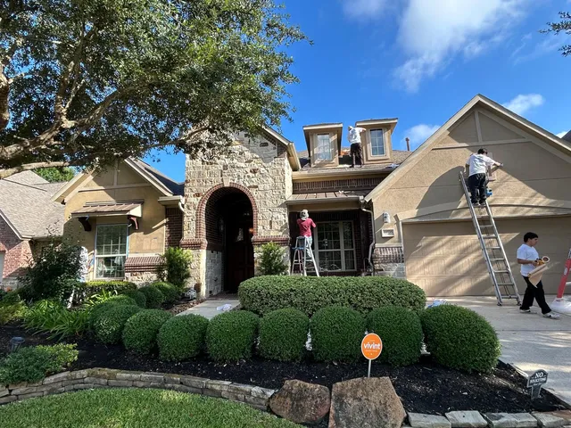 AA Home Remodeling crew working on a Houston home exterior