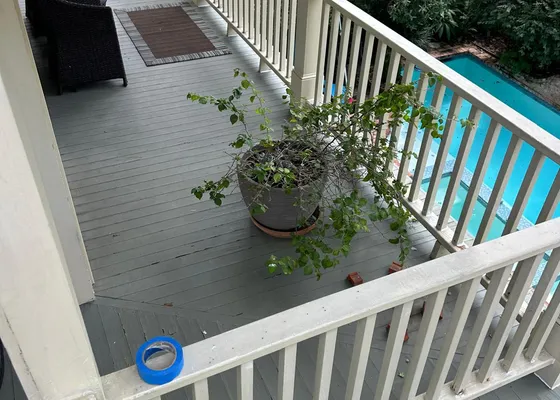 Covered porch overlooking a pool at a Sugar Land, TX home