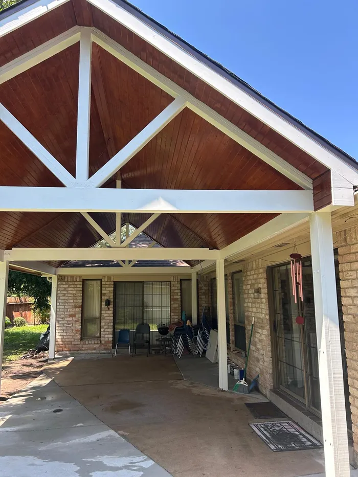 Finished covered patio addition at a brick Houston home